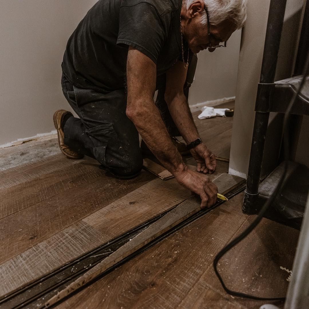 Wood floor installer at work